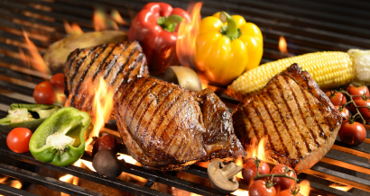 Grilled meat /steak with vegetable on the flaming grill